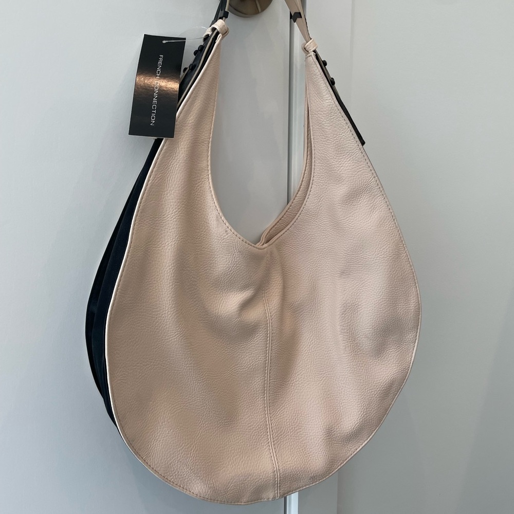 Pink, leather French Connection bag with black details / handles